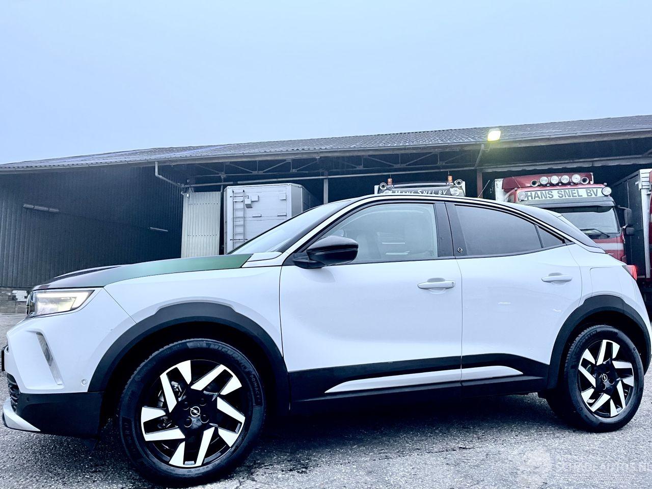 Opel Mokka-E 50-kWh 11kW bl. Business Elegance aut 136pk - nap - stuurverwarming - navi - camera - line + side assist - keyless - virtual - 2x laadkabels - org NL