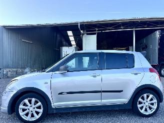 Schadeauto Suzuki Swift 1.3i 92pk GLS 5drs - nap - airco - camera - touchscreen multimedia - bleutooth - alcantara hemel + stuur 2006/10