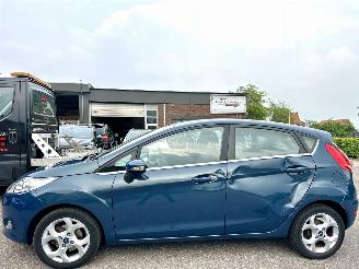 Unfallwagen Ford Fiesta 1.25i 82pk Titanium 5drs - 94dkm nap - airco - cruise - licht + regensensor + aut dimmend binnenspiegel - lmv 2009/3