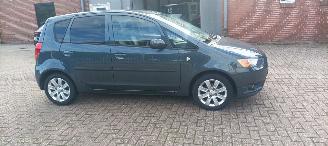 Mitsubishi Colt 1.3-16v Automaat 95pk Airco Lichtautomaat cruisecontrol Regensensor 4xElektrische ramen Elektrische-spiegels met verwarming Centrale vergrendeling met afstandsbediening Privacyglas leren stuurwiel mistlampen Metallic Lak Trekhaak  volledig Onderhouden! picture 8