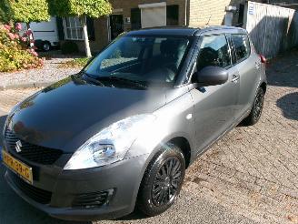 Damaged car Suzuki Swift 1.2 COMFORT 4X4 AIRCO 2012/6