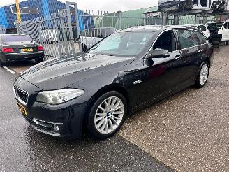 Schadeauto BMW 5-serie TOURING 520i Luxury Edition 2014/5